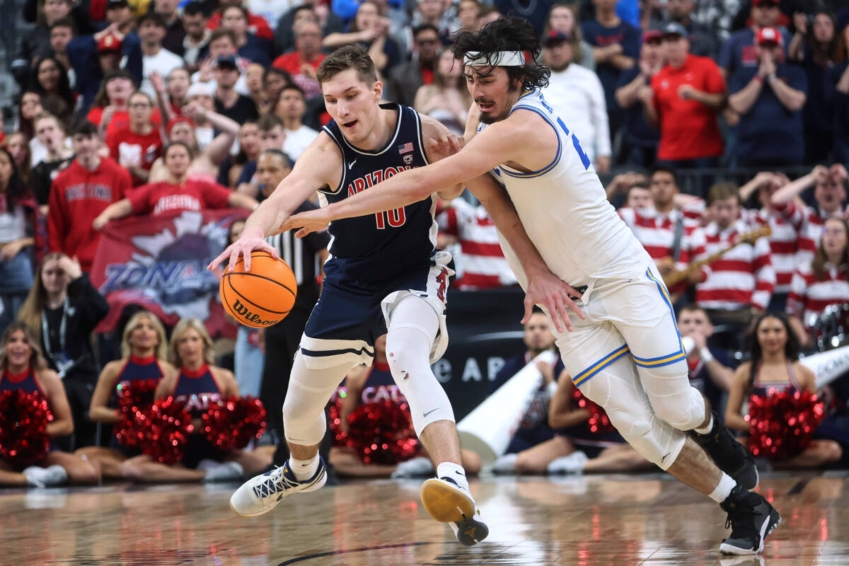 Arizona forward Azuolas Tubelis (10) is defended by UCLA guard Jaime Jaquez Jr. during the seco ...