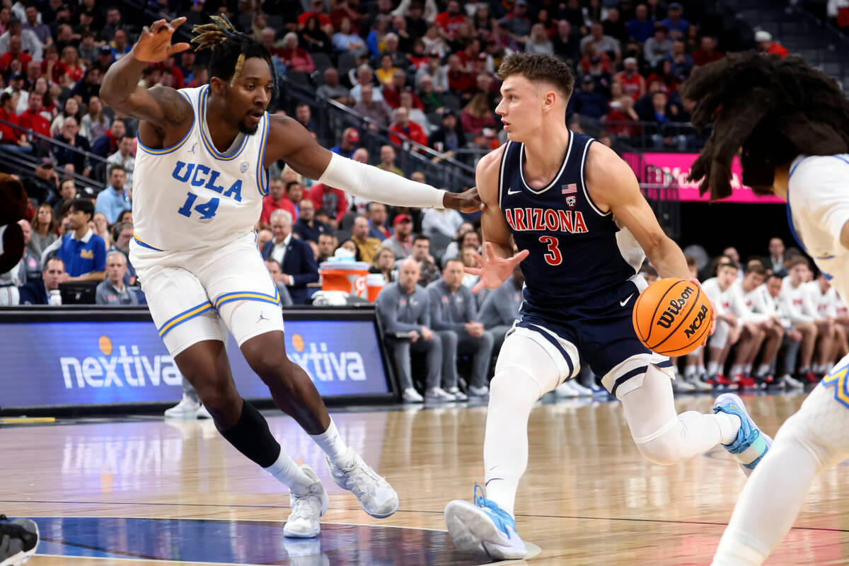 Arizona guard Pelle Larsson (3) drives the ball against UCLA forward Kenneth Nwuba (14) during ...