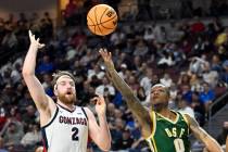 San Francisco guard Khalil Shabazz (0) shoots against Gonzaga forward Drew Timme (2) during the ...