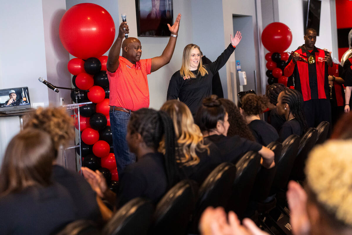 UNLV athletic director Erick Harper, left, and UNLV Lady Rebels head coach Lindy La Rocque chee ...