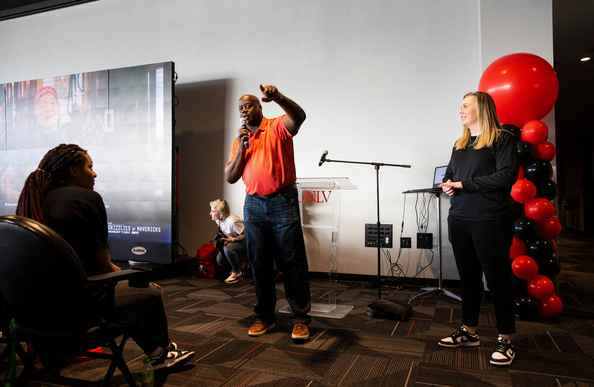 UNLV athletic director Erick Harper speaks alongside UNLV Lady Rebels head coach Lindy La Rocqu ...