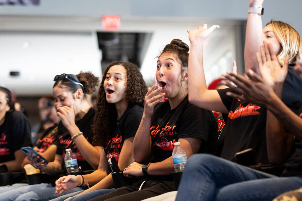 UNLV Lady Rebels players, including Kiara Jackson, center left, and Alyssa Durazo-Frescas, righ ...