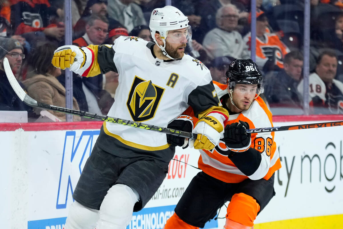 Vegas Golden Knights' Alex Pietrangelo, left, and Philadelphia Flyers' Joel Farabee collide dur ...