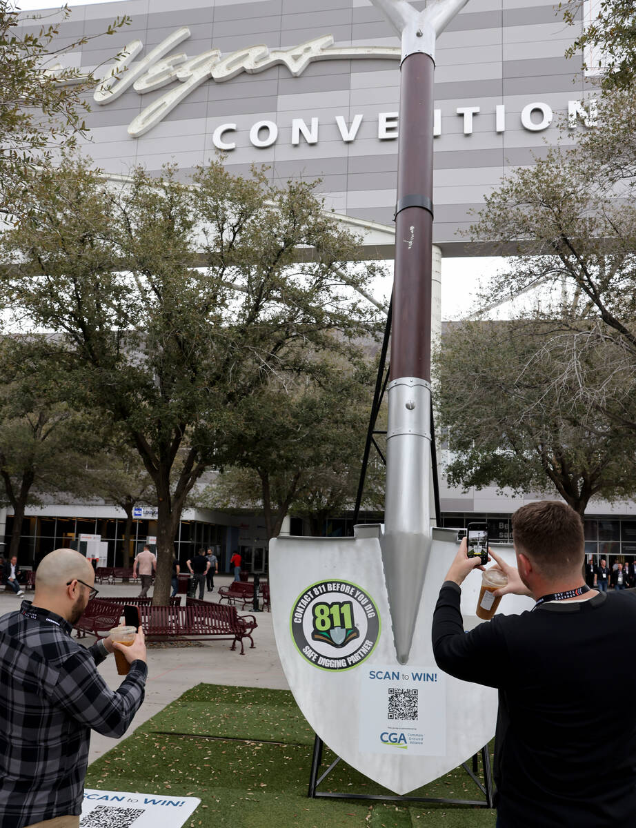 Conventioneers Collin Miyadi, left, and Matt Dodd, both of Concord, Calif. arrive at the Las Ve ...