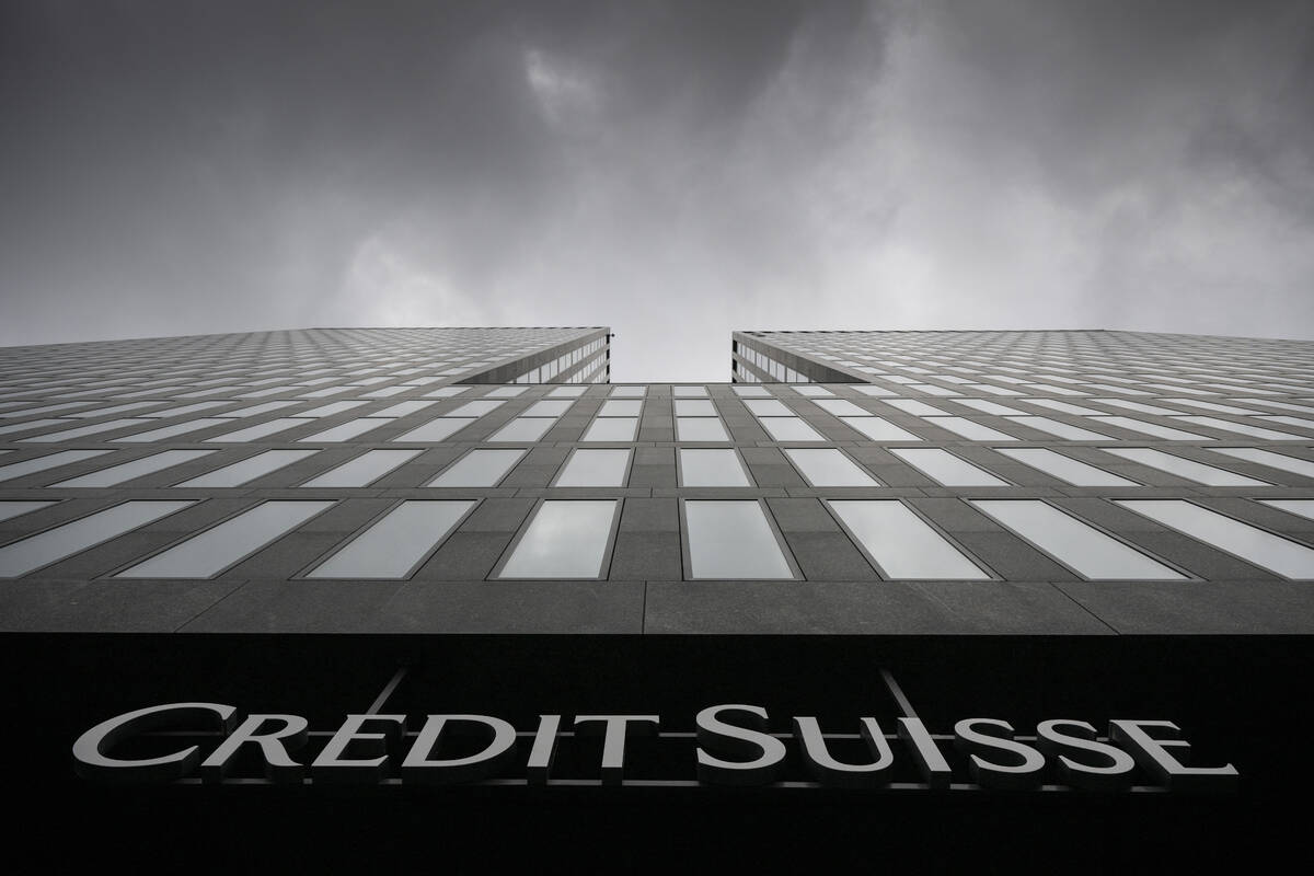 FILE - Grey clouds cover the sky over a building of the Credit Suisse bank in Zurich, Switzerla ...