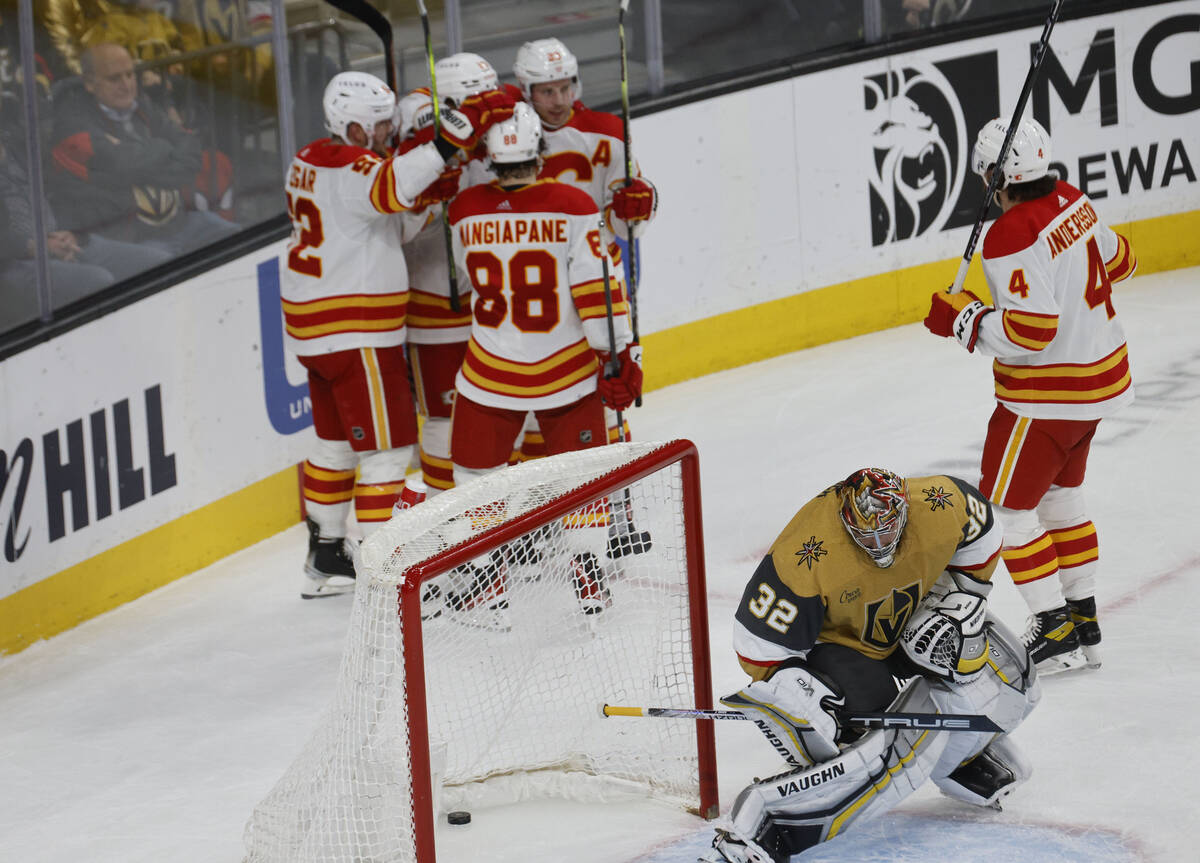 Vegas Golden Knights goaltender Jonathan Quick (32) looks down after Calgary Flames center Blak ...