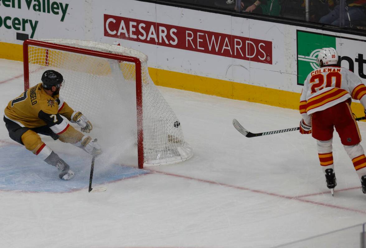 Calgary Flames center Blake Coleman (20) scores a goal as Vegas Golden Knights defenseman Alex ...