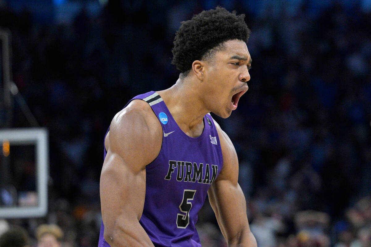 Furman guard Marcus Foster (5) celebrates after what proved to be the game-winning basket by gu ...