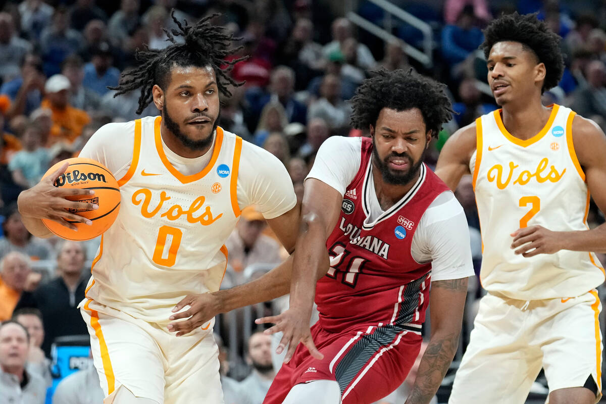 Tennessee forward Jonas Aidoo (0) steals a rebound from Louisiana forward Jordan Brown (21) dur ...