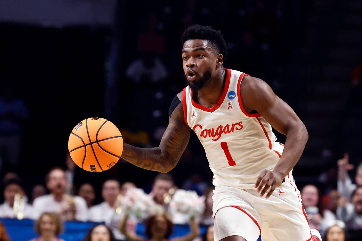 Houston guard Jamal Shead brings the ball up during the first half of the team's first-round co ...