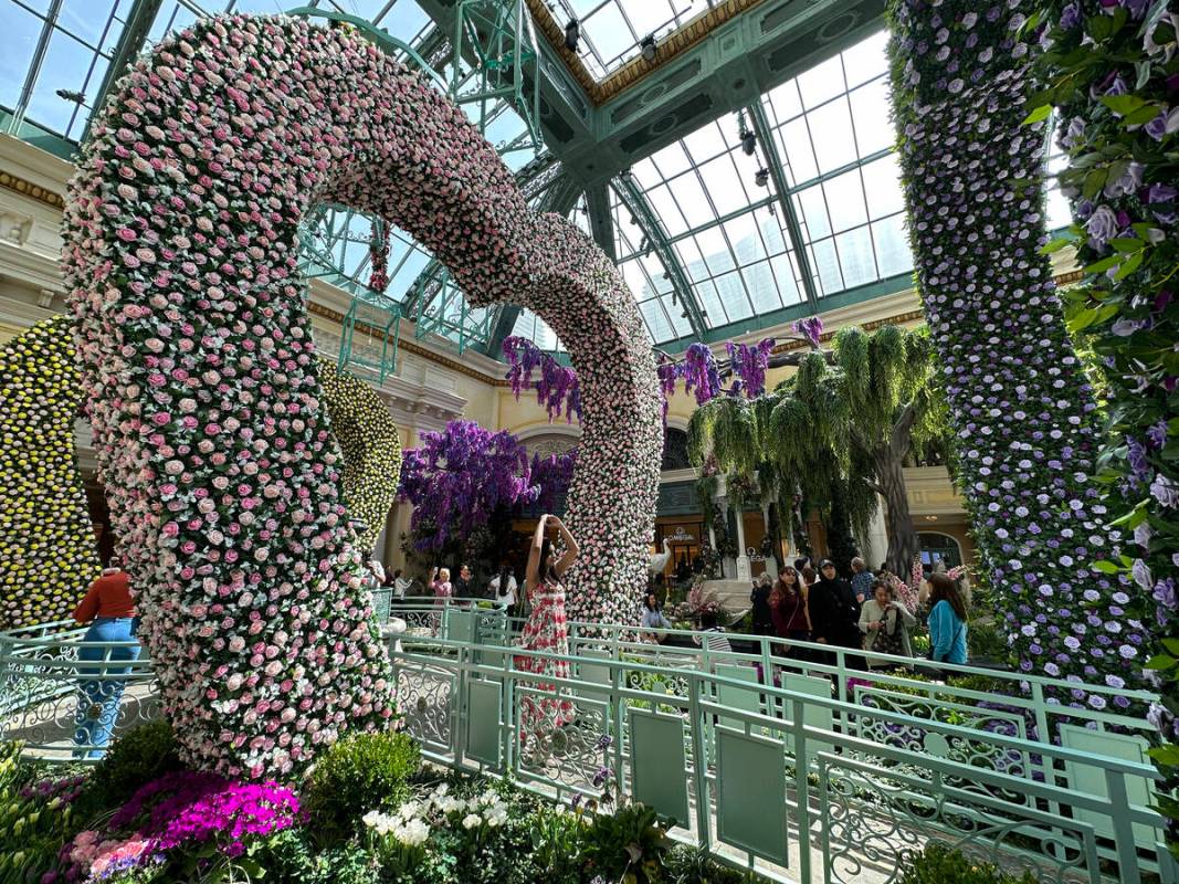 Guests take in the new spring display, “Giardino Dell’ Amore,” at the Bell ...