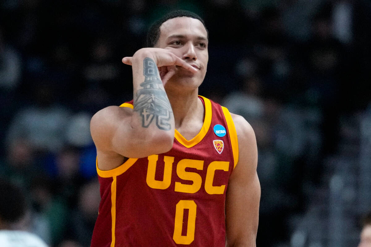 Southern California forward Kobe Johnson (0)] celebrates after a basket against Michigan State ...