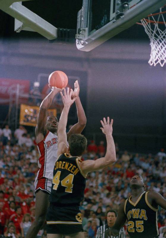 University of Nevada-Las Vegas forward Armon Gilliam (left) puts up a shot as Iowa forward Al L ...