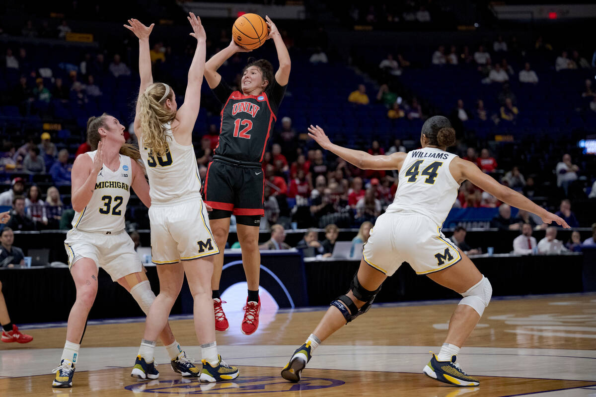 UNLV guard Alyssa Durazo-Frescas (12) shoots over Michigan guard Elise Stuck (30) in the first ...