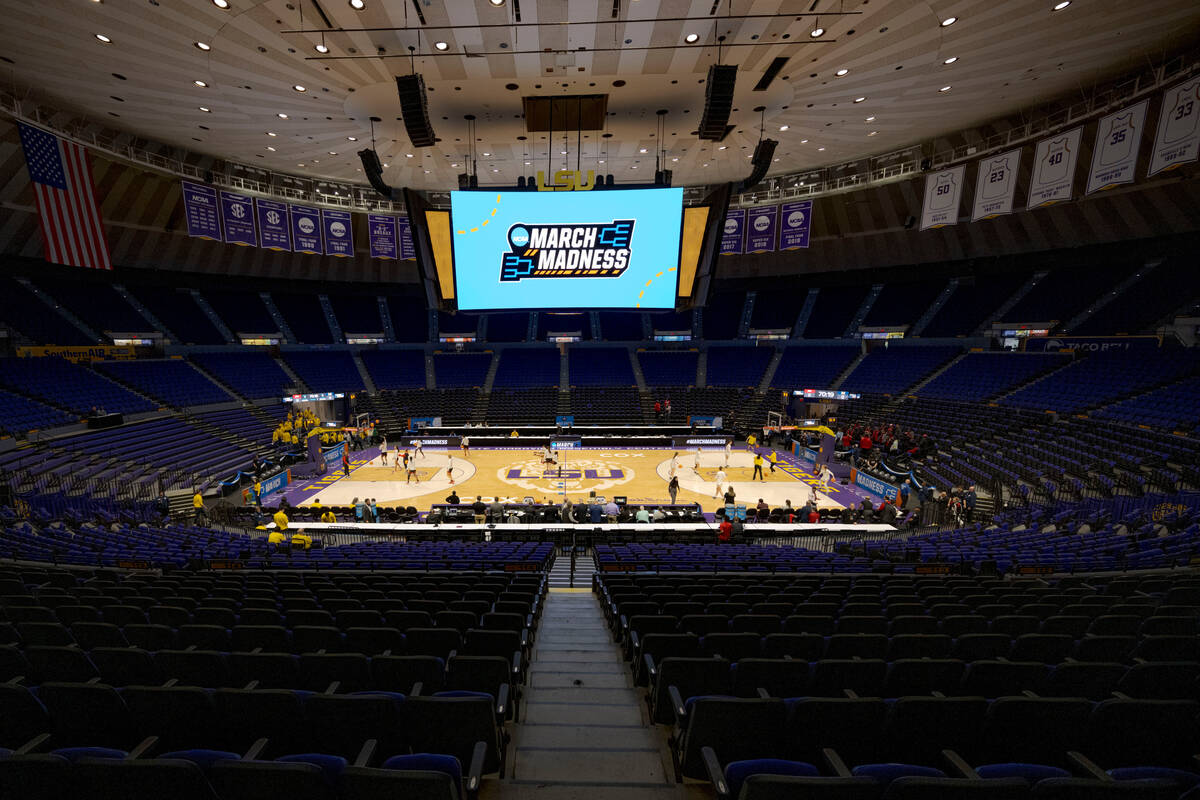 Michigan and UNLV warm up before a first-round college basketball game in the women's NCAA Tour ...