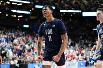 Fairleigh Dickinson forward Sean Moore (11) reacts to a basket against Purdue in the second hal ...