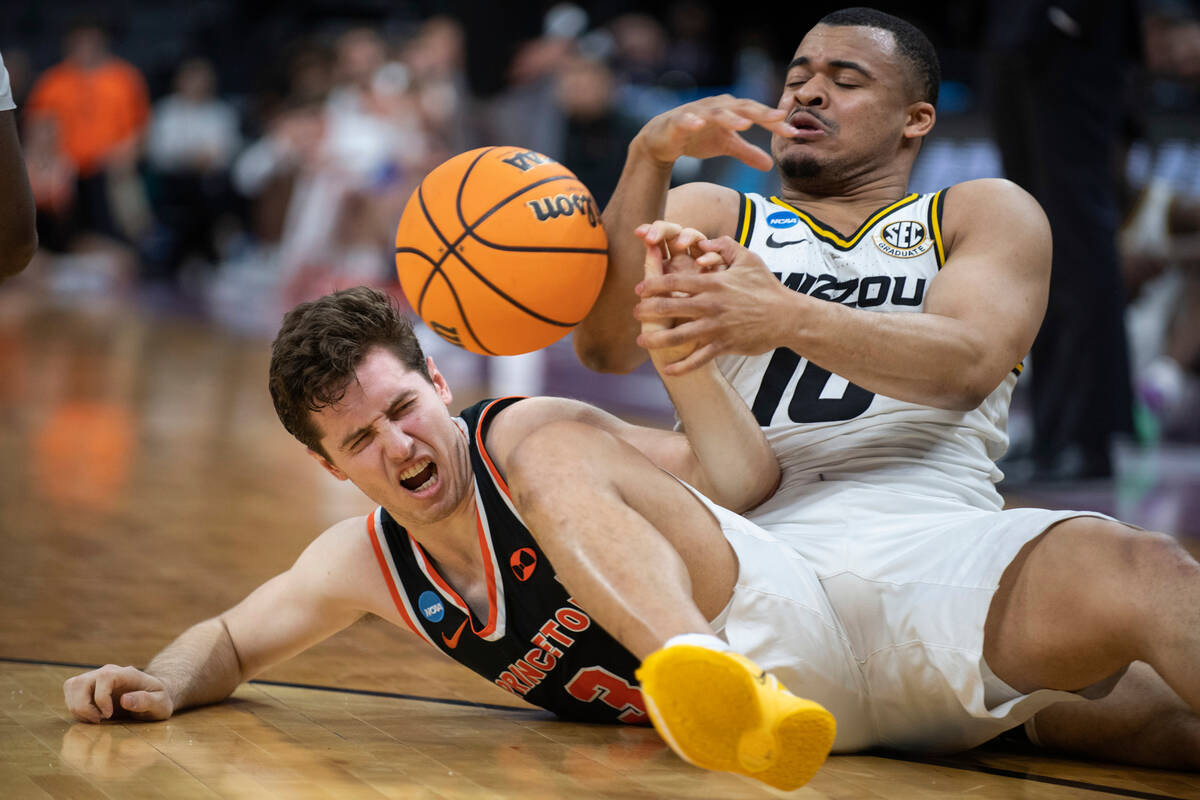 Princeton guard Ryan Langborg (3) and Missouri guard Nick Honor (10) scramble for the ball duri ...