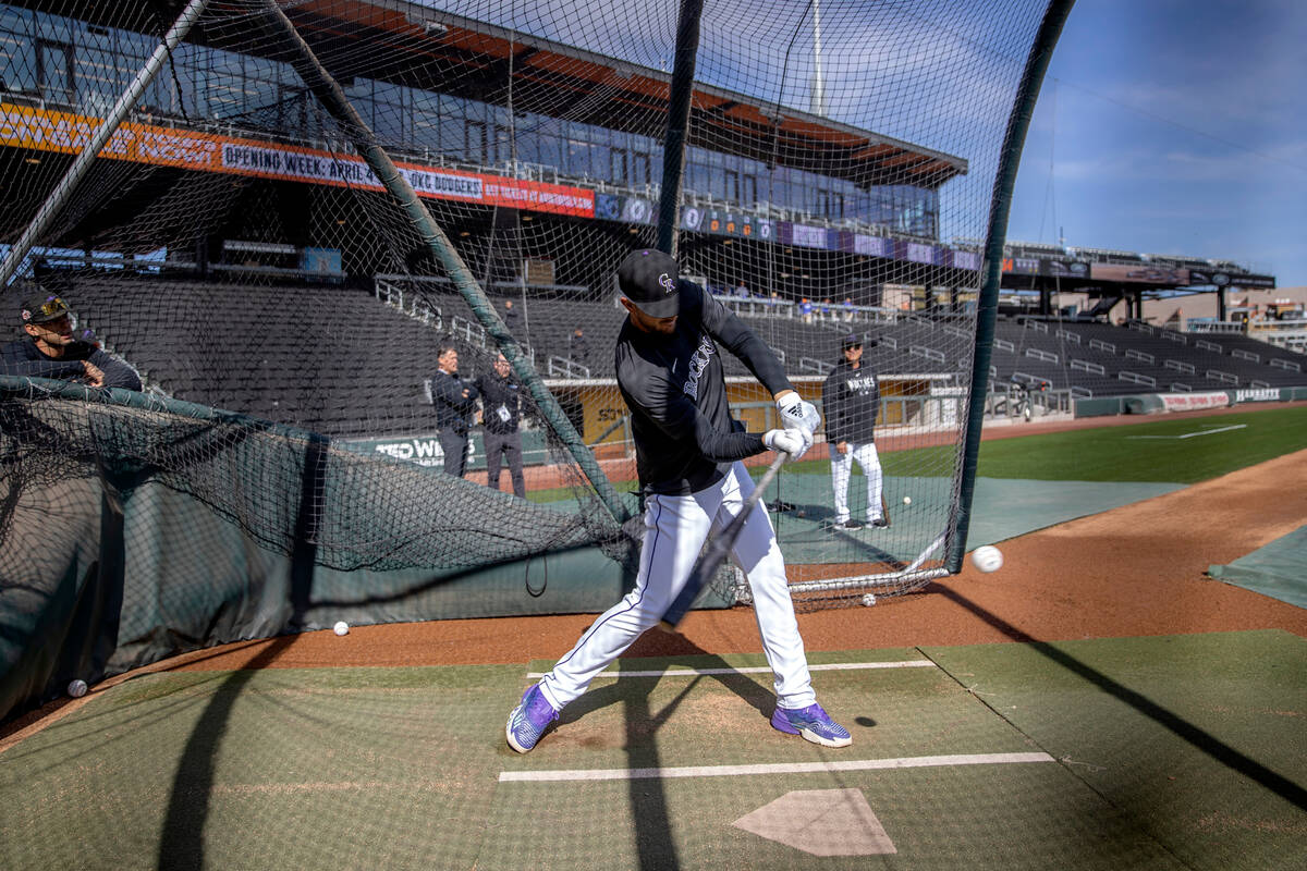 Kris Bryant of the Colorado Rockies bats during practice before an MLB exhibition game between ...