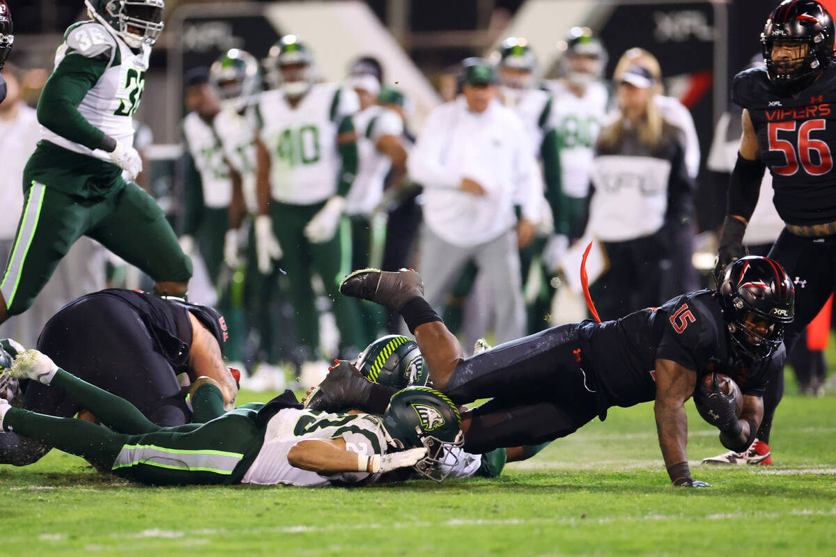 Vegas Vipers running back Rod Smith dives to the ground after running the ball against the Orla ...