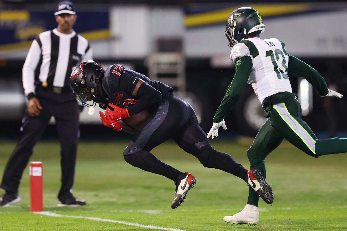 Vegas Vipers wide receiver Jeff Badet (13) makes a touchdown catch under pressure from Orlando ...