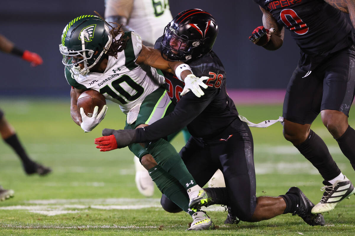 Vegas Vipers outside linebacker C.J. Avery (28) tackles Orlando Guardians wide receiver Deddric ...