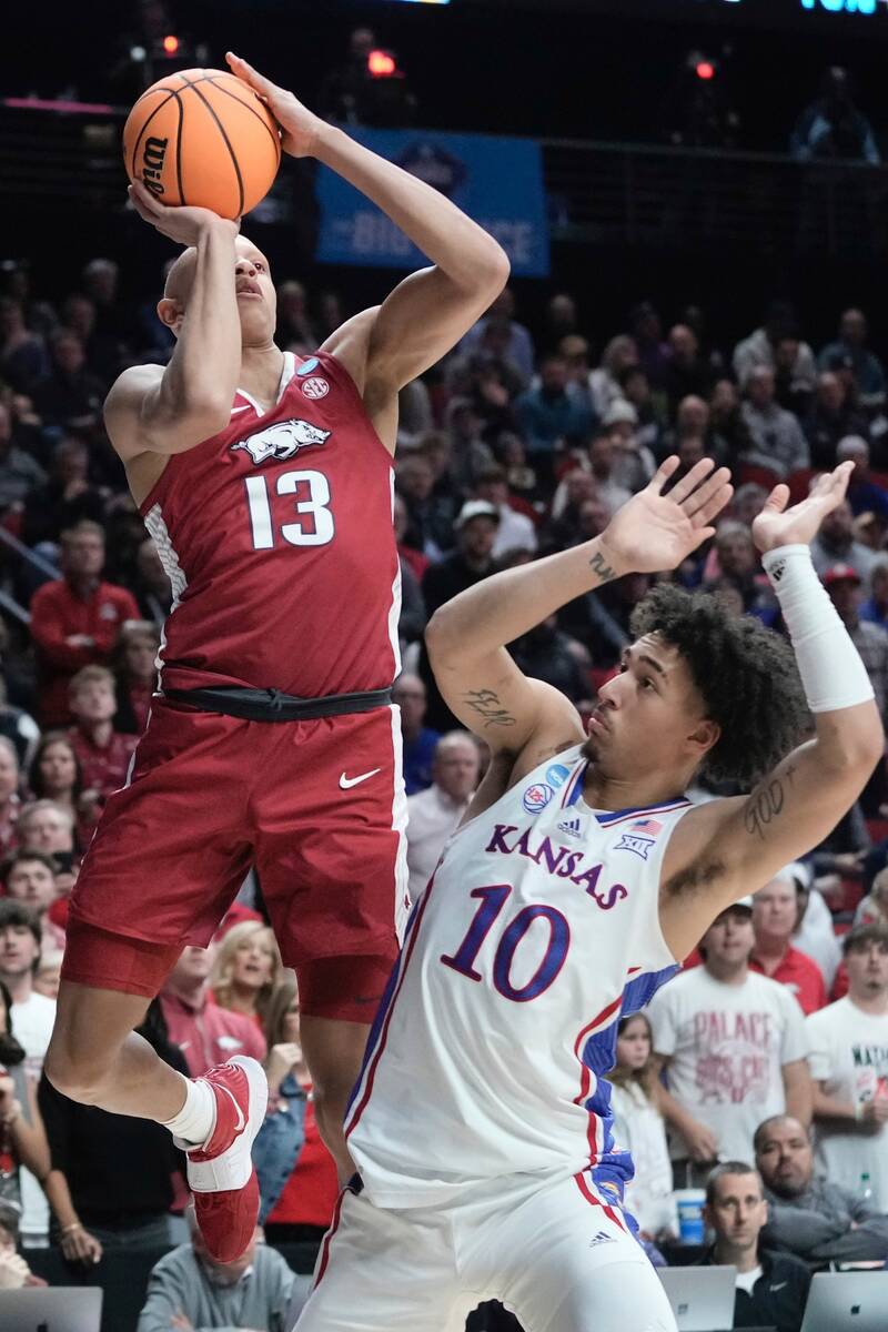 Arkansas' Jordan Walsh shoots over Kansas' Jalen Wilson during the second half of a second-roun ...