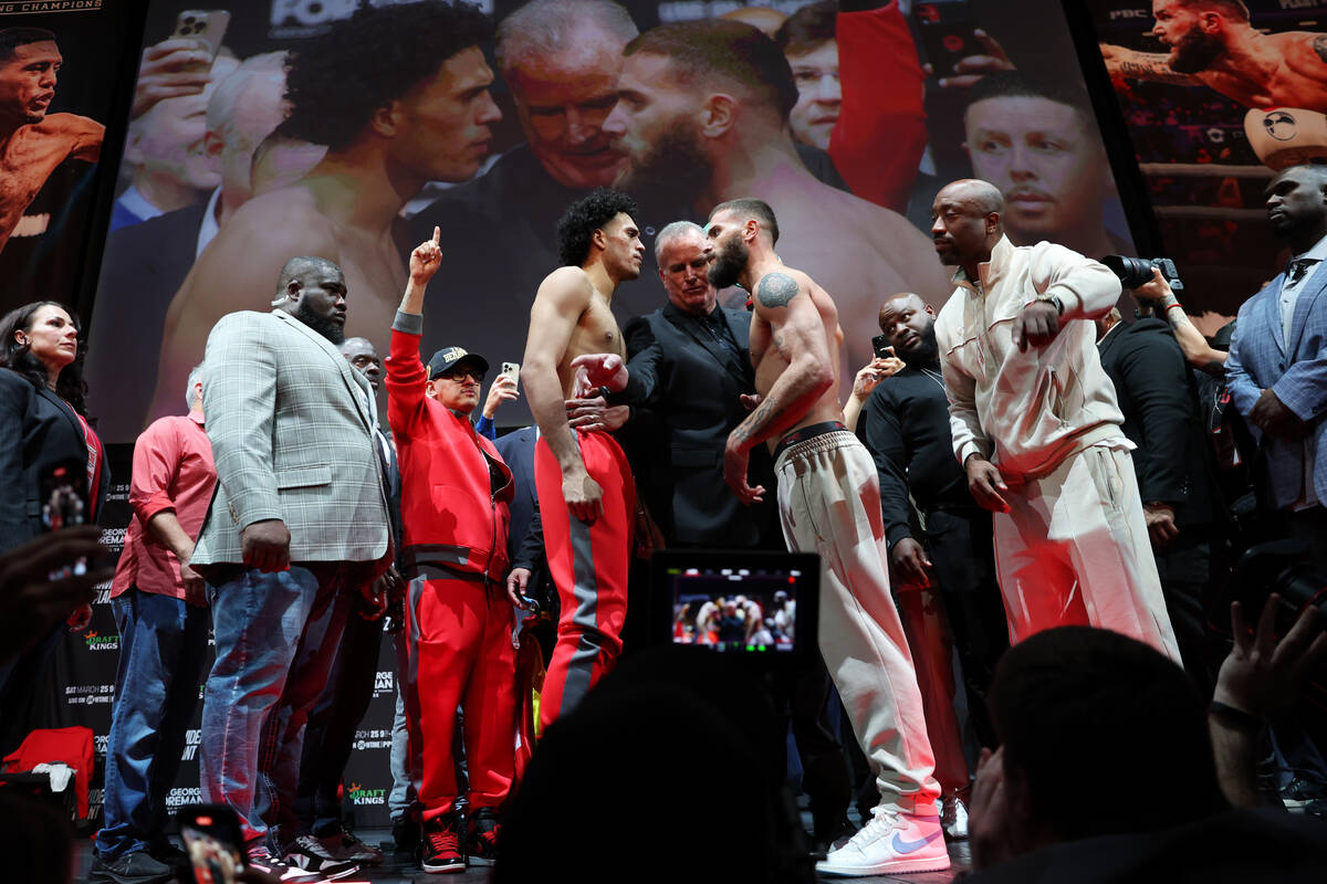 David Benavidez, left, and Caleb Plant, face off during a weigh-in event in advance of their su ...