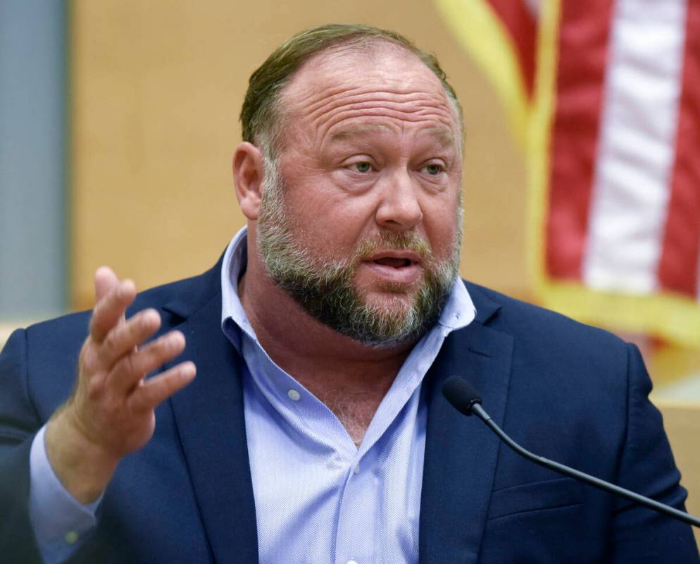 FILE - Conspiracy theorist Alex Jones takes the witness stand to testify at the Sandy Hook defa ...