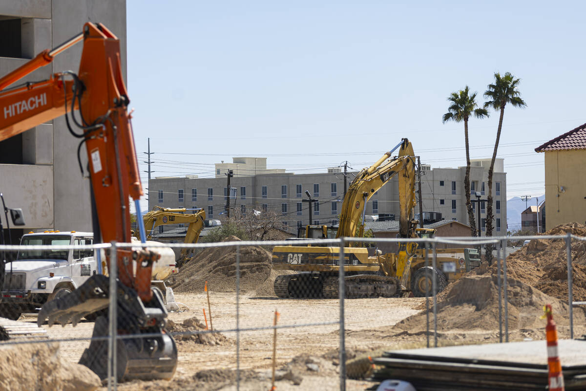 Construction continues on an apartment project by The Calida Group being built behind the renov ...