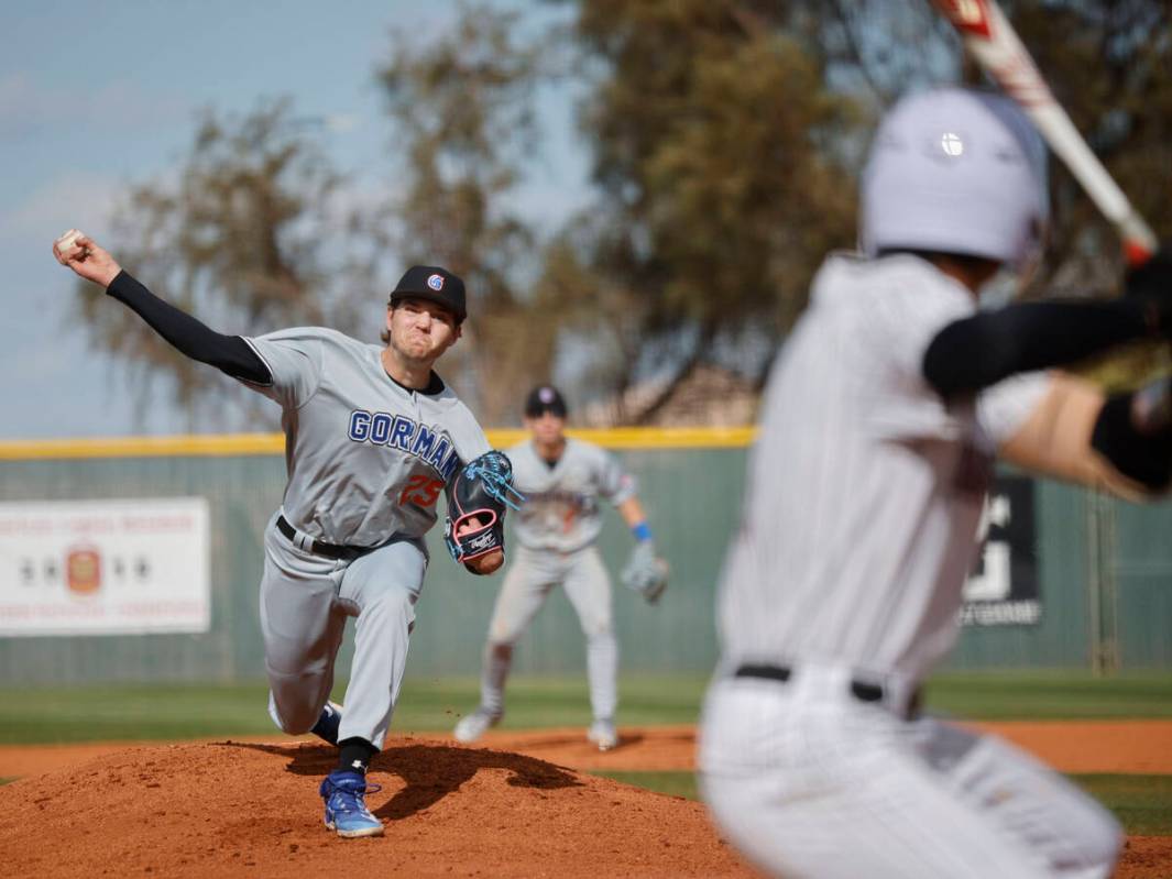 Bishop Gorman's Kamdyn Perry (25) delivers to Desert Oasis' Noah Griffith (17) during the first ...