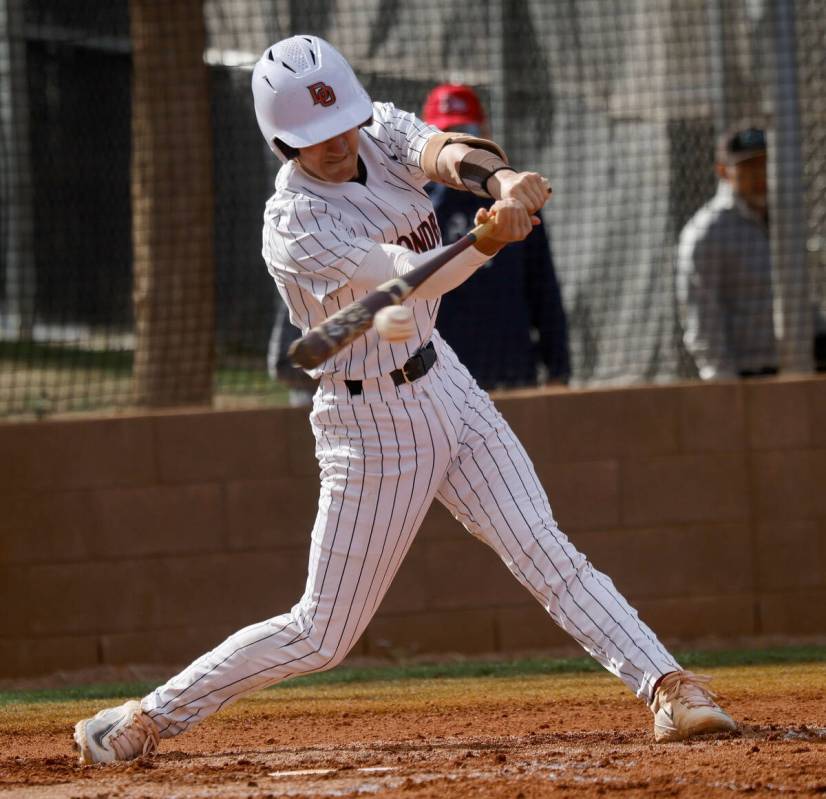 Desert Oasis' Porter Brunn (26) connects with the ball during the first inning of a baseball ga ...