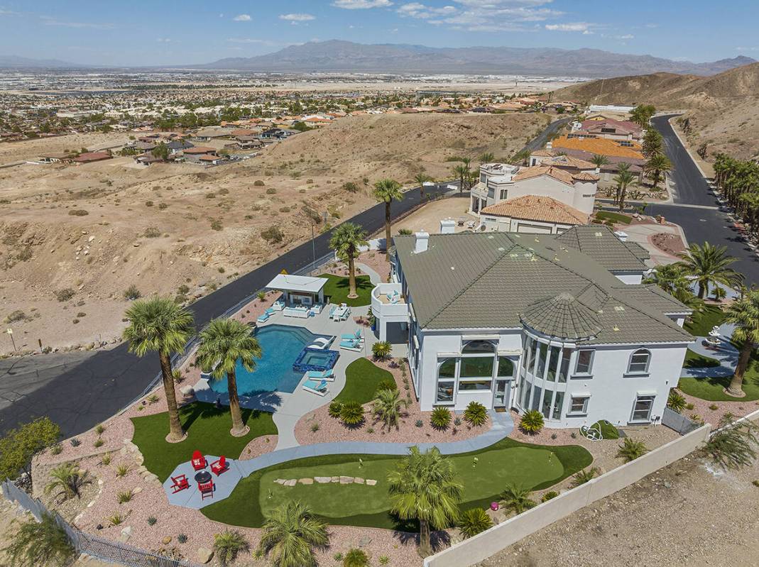 The 7,795-square-foot home sits on the western base of Frenchman Mountain, east of Las Vegas, i ...