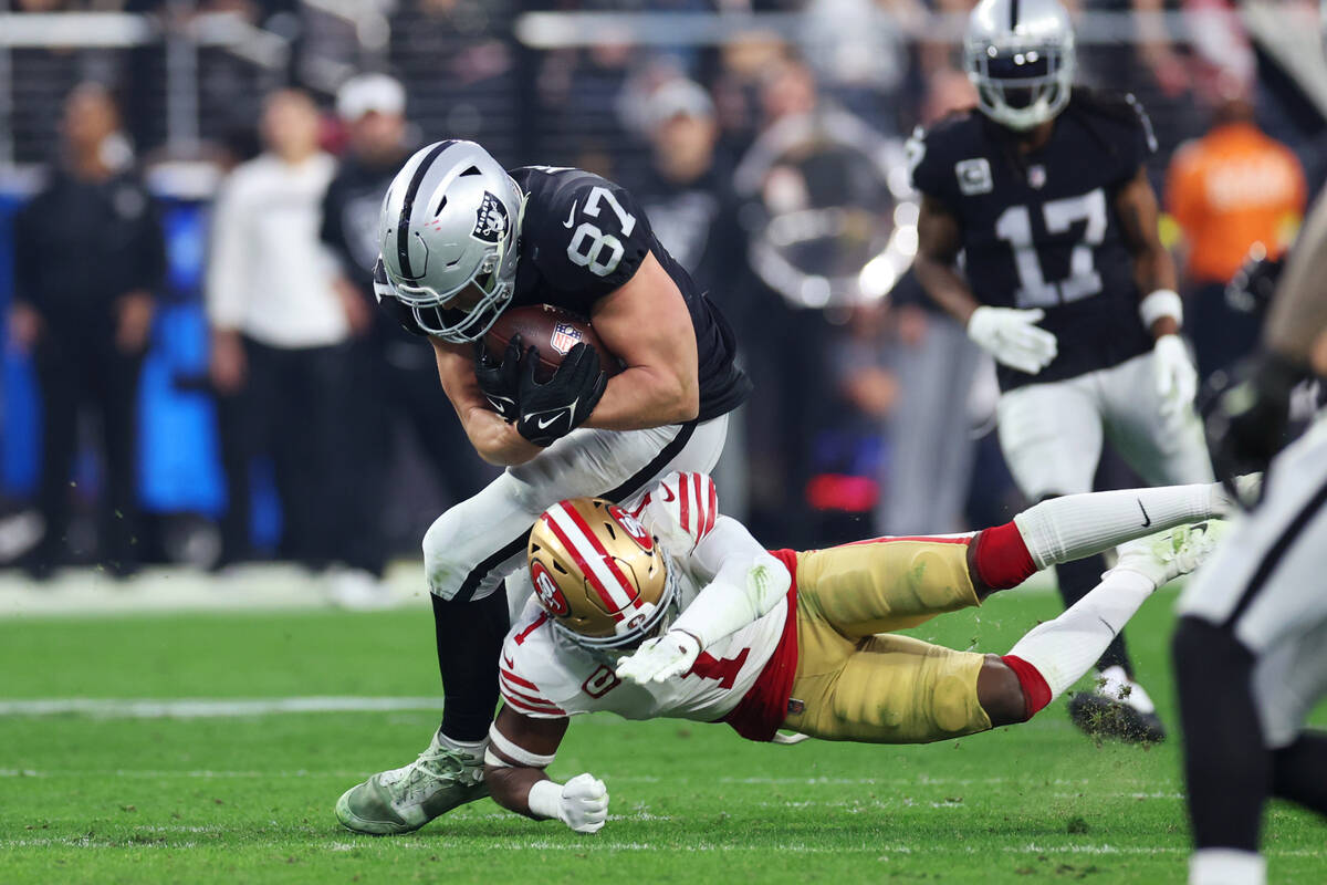 Raiders tight end Foster Moreau (87) is tackled by San Francisco 49ers cornerback Jimmie Ward ( ...