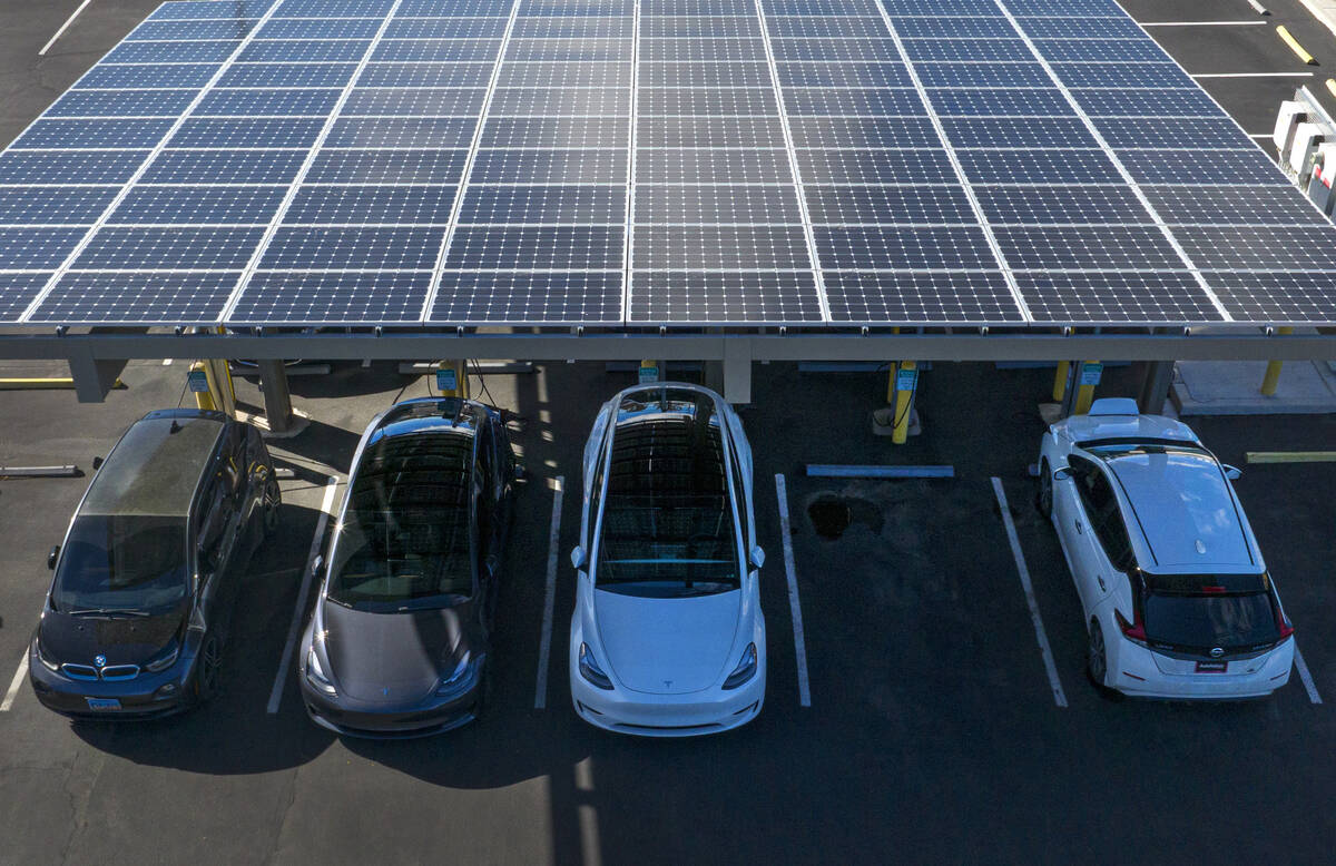 Electric vehicles get their battery recharged in the parking lot of NV Energy's headquarters at ...