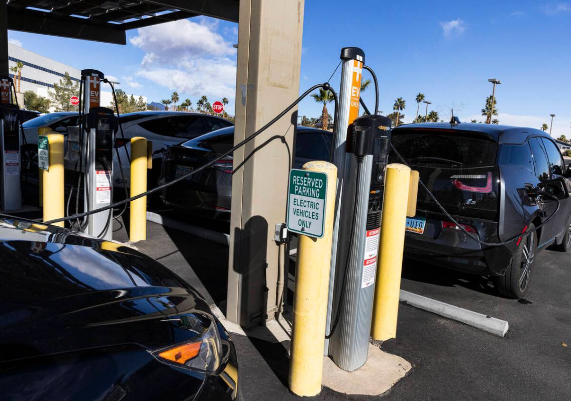 Electric vehicles get their battery recharged in the parking lot of NV Energy's headquarters at ...