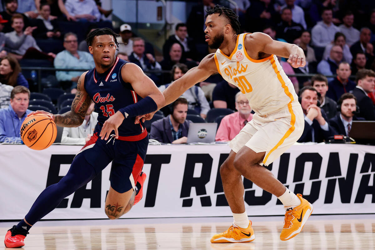 Florida Atlantic guard Alijah Martin (15) is defended by Tennessee guard Josiah-Jordan James (3 ...