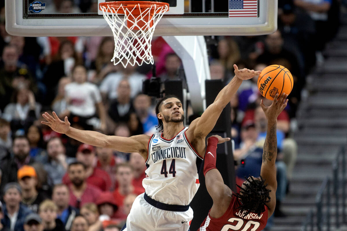 Connecticut Huskies guard Andre Jackson Jr. (44) blocks a shot by Arkansas Razorbacks forward K ...