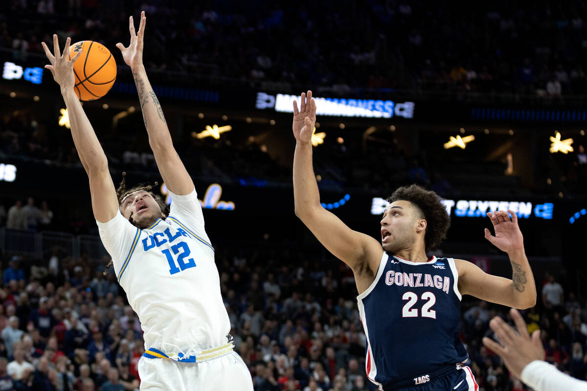 UCLA Bruins forward Mac Etienne (12) loses control of his shot while Gonzaga Bulldogs forward A ...