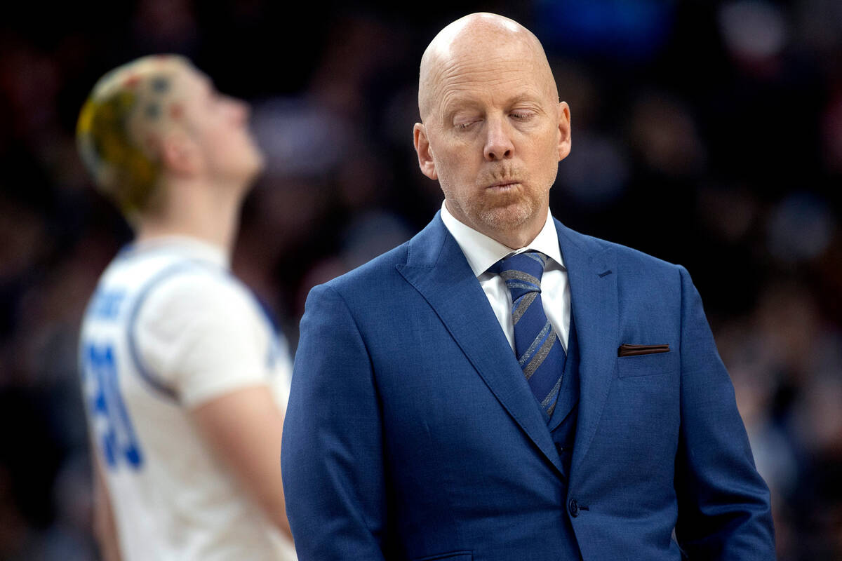 UCLA Bruins head coach Mick Cronin walks into a timeout huddle during the second half of a West ...