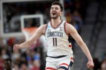 Connecticut Huskies forward Alex Karaban (11) celebrates after dunking during a West Regional N ...