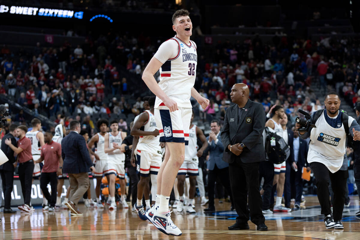 Connecticut Huskies center Donovan Clingan (32) celebrates after winning a West Regional NCAA s ...