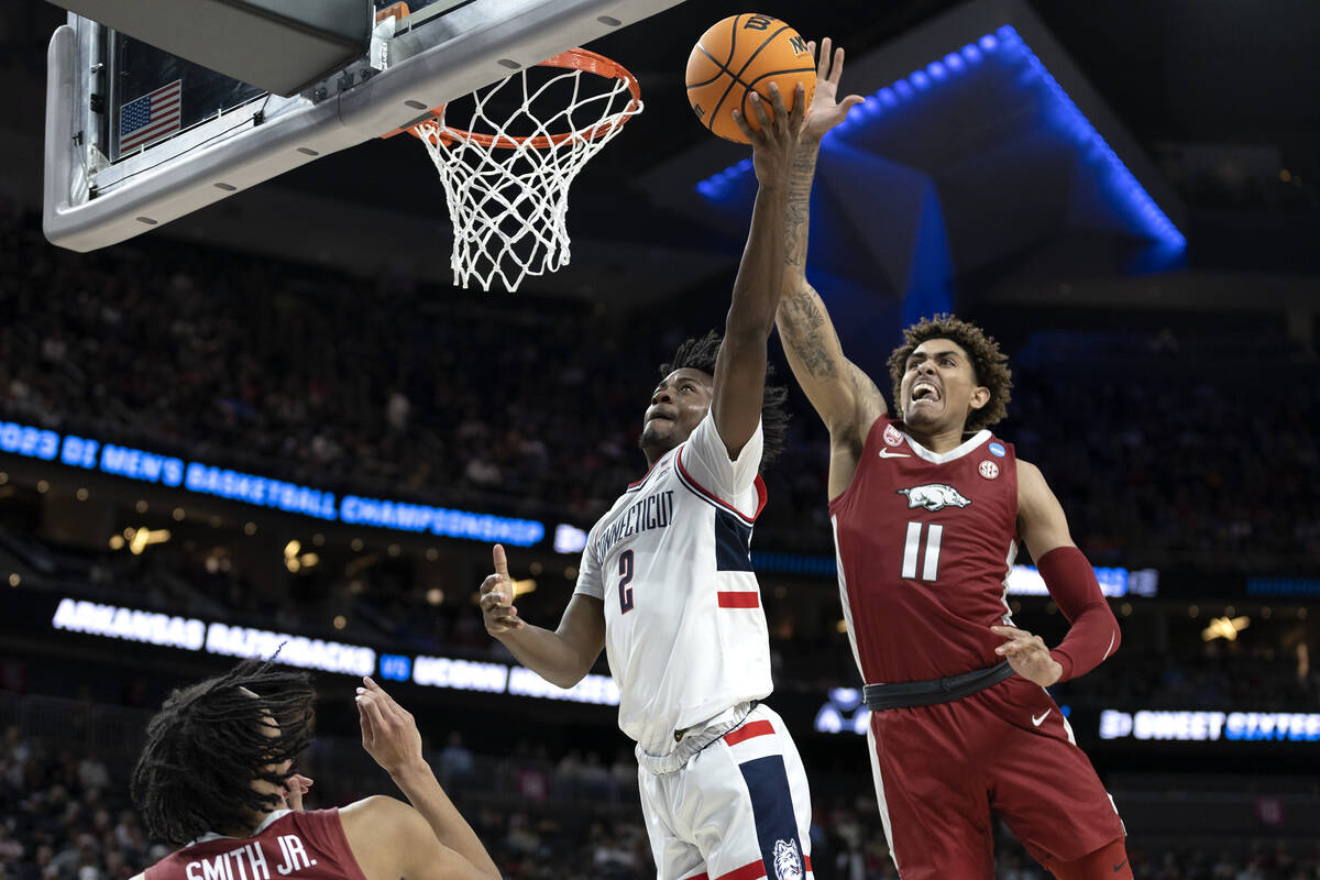 Connecticut Huskies guard Tristen Newton (2) shoots against Arkansas Razorbacks forward Jalen G ...