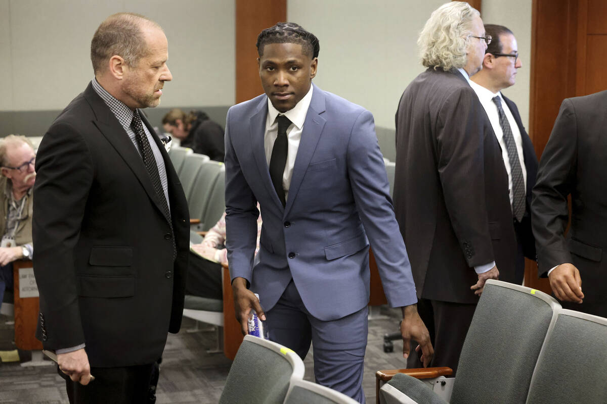 Kansas City Chiefs cornerback Chris Lammons, center, arrives in court with his attorney Ross Go ...