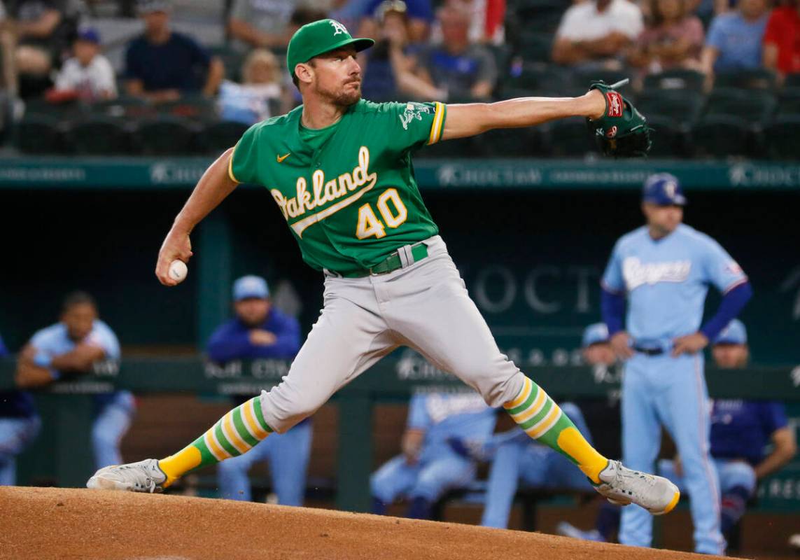 Oakland Athletics starting pitcher Chris Bassitt throws against the Texas Rangers during the fi ...