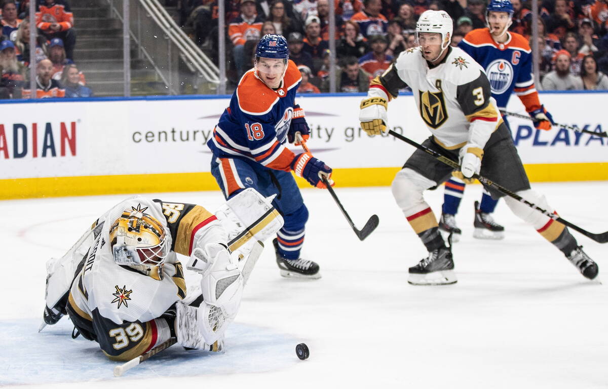 Vegas Golden Knights goalie Laurent Brossoit (39) makes a save as Edmonton Oilers' Zach Hyman ( ...