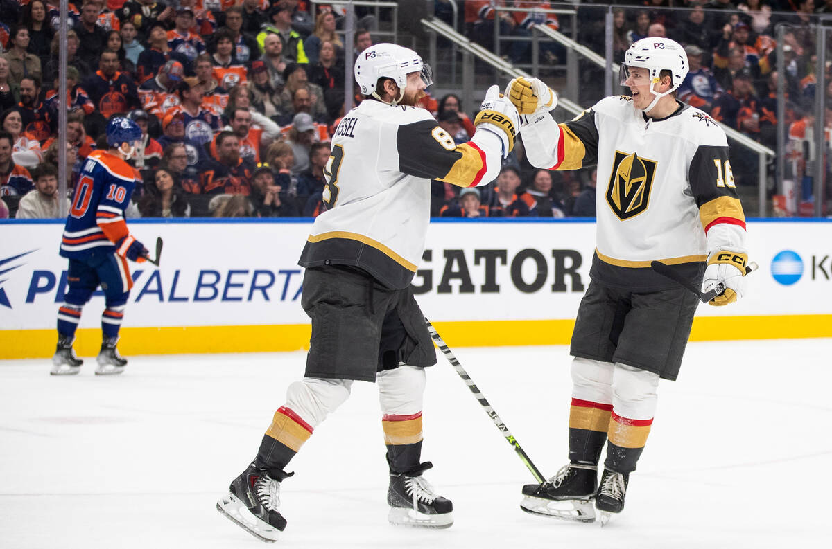 Vegas Golden Knights' Phil Kessel (8) and Pavel Dorofeyev (16) celebrate a goal against the Edm ...