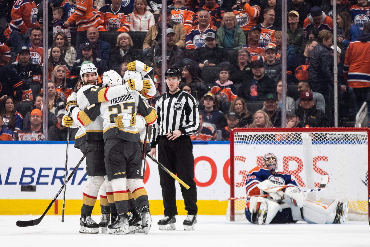 Vegas Golden Knights celebrate an overtime goal on Edmonton Oilers goalie Stuart Skinner (74) d ...