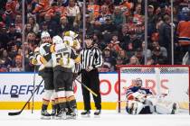 Vegas Golden Knights celebrate an overtime goal on Edmonton Oilers goalie Stuart Skinner (74) d ...