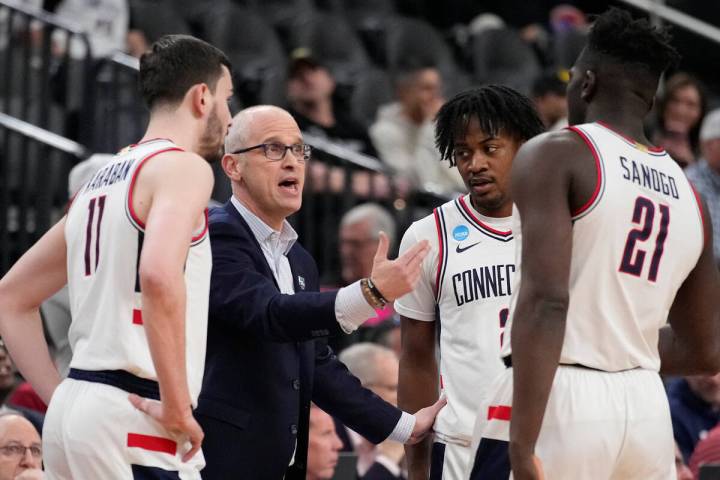 UConn head coach Dan Hurley speaks with his team in the first half of a Sweet 16 college basket ...