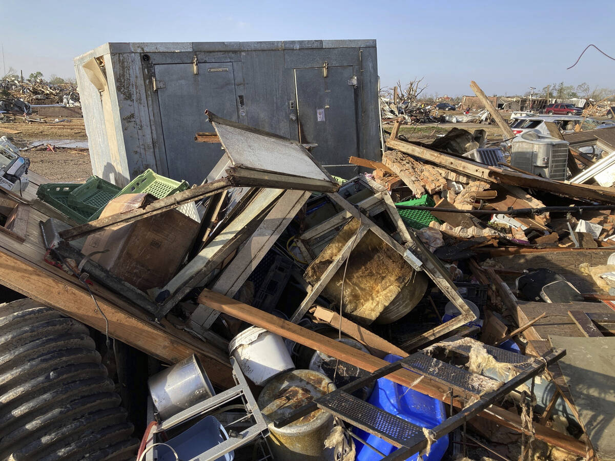 Debris covers the ground from a diner, Chuck’s dairy bar early Saturday, March 25, 2023 ...